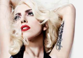 lady gaga gets trumpet tattoo on arm - India TV lady gaga gets trumpet tattoo on arm - India TV