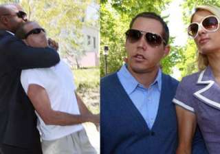 man tries to grab paris hilton s boyfriend -... man tries to grab paris hilton s boyfriend -...