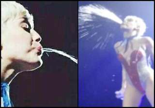 miley cyrus outrageous act spits at audience see... miley cyrus outrageous act spits at audience see...