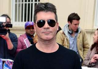simon cowell excited to become father - India TV simon cowell excited to become father - India TV