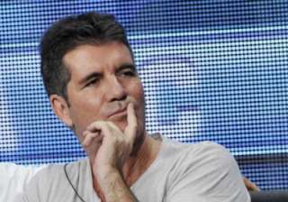 simon cowell to offer child support - India TV simon cowell to offer child support - India TV