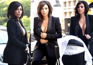 kim kardashian goes braless in plunging cleavage... kim kardashian goes braless in plunging cleavage...