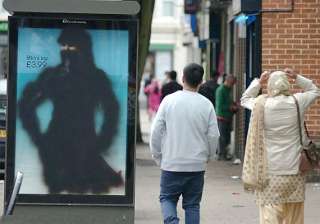 bikini covered with burkha uk muslims daub paint... bikini covered with burkha uk muslims daub paint...