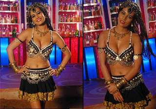 poonam pandey flaunts cleavage in item number... poonam pandey flaunts cleavage in item number...