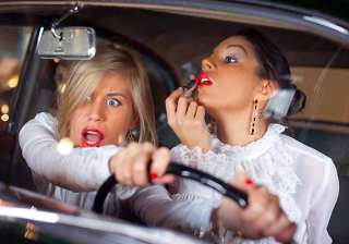 most women do up face while driving - India TV most women do up face while driving - India TV