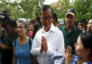 cambodian opposition chief home to face standoff... cambodian opposition chief home to face standoff...
