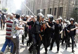 egyptian riot police fire tear gas at protesters... egyptian riot police fire tear gas at protesters...