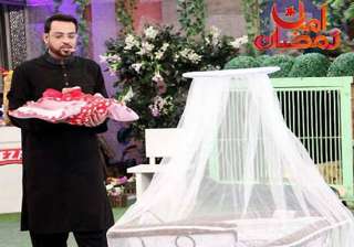 furore over pak tv quiz show host gifting orphan... furore over pak tv quiz show host gifting orphan...