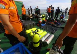 airasia qz8501 search teams find two large... airasia qz8501 search teams find two large...
