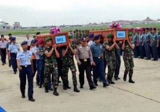 airasia crash eighth body recovered bad weather... airasia crash eighth body recovered bad weather...