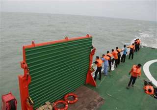 tail of missing airasia plane discovered in java... tail of missing airasia plane discovered in java...