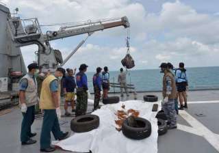 airasia crash search personnel lift plane s tail... airasia crash search personnel lift plane s tail...