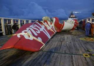 tail of airasia plane arrives at port airbus... tail of airasia plane arrives at port airbus...