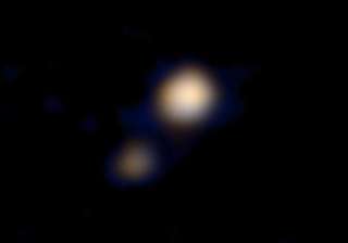 nasa reveals first ever colour image of pluto -... nasa reveals first ever colour image of pluto -...