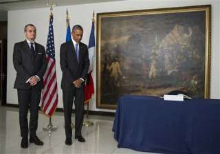 obama pays respects at french embassy after paris... obama pays respects at french embassy after paris...