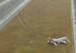 asiana passenger plane skids off runway in japan... asiana passenger plane skids off runway in japan...