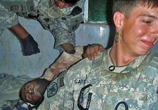 outrage as us soldiers pose with severed bodies... outrage as us soldiers pose with severed bodies...