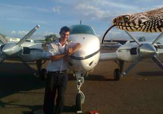 pilot turns back after snake pops out of... pilot turns back after snake pops out of...
