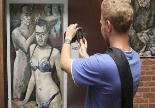 russian police seize painting of putin in women s... russian police seize painting of putin in women s...