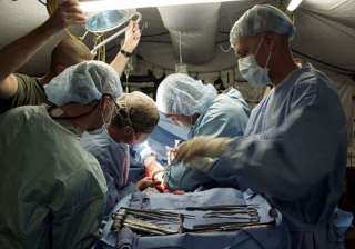 surgeons perform first triple limb face... surgeons perform first triple limb face...