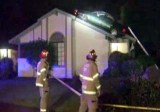 thief in us lands stolen car on roof - India TV thief in us lands stolen car on roof - India TV
