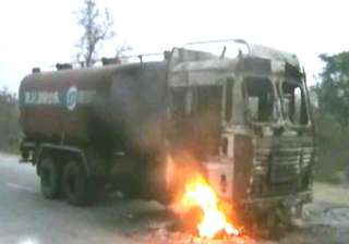 14 trucks torched after woman s death under... 14 trucks torched after woman s death under...