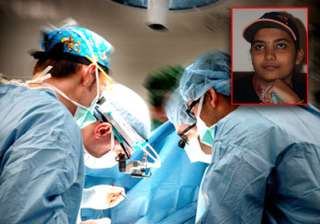 doctors perform rare surgery with patient... doctors perform rare surgery with patient...