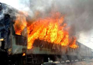 mob sets afire train compartment at delang... mob sets afire train compartment at delang...