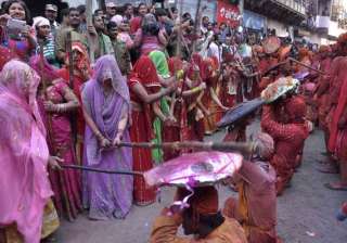 know about lathmar holi of barsana when women... know about lathmar holi of barsana when women...