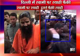 man throws black ink at swami ramdev bashed up by... man throws black ink at swami ramdev bashed up by...