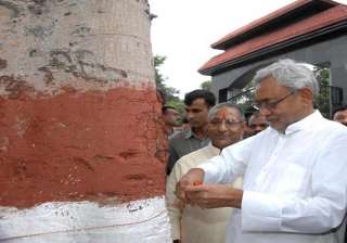 nitish ties rakhi to tree for protection of... nitish ties rakhi to tree for protection of...