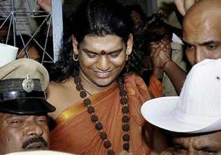 nityananda booked for mixing holy water with... nityananda booked for mixing holy water with...