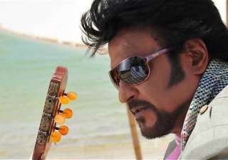 rajni fans eat rice spread on floor for his... rajni fans eat rice spread on floor for his...