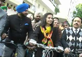 sidhu s wife navjot rides bicycle to file... sidhu s wife navjot rides bicycle to file...