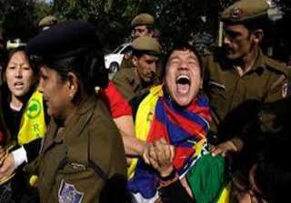 tibetans protest chinese foreign minister s visit... tibetans protest chinese foreign minister s visit...