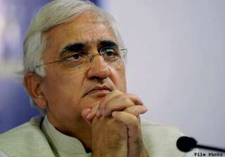 bjp activists burn khurshid s effigy for remarks... bjp activists burn khurshid s effigy for remarks...