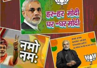 black paint smeared on modi posters in varanasi -... black paint smeared on modi posters in varanasi -...