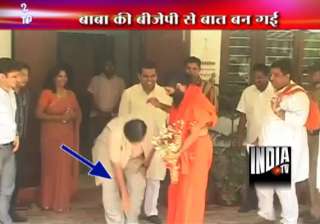 gadkari touches ramdev s feet seeks his blessings... gadkari touches ramdev s feet seeks his blessings...