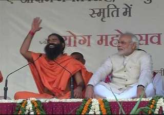 modi says govt harassing ramdev for raising black... modi says govt harassing ramdev for raising black...