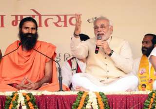 ramdev supporters root for modi at yoga guru s... ramdev supporters root for modi at yoga guru s...