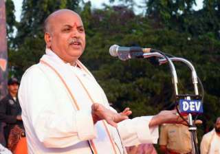 togadia booked for violating model code of... togadia booked for violating model code of...