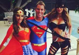 superman shane warne celebrates new year with... superman shane warne celebrates new year with...