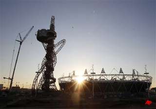 london s olympic orbit towers gets decked in... london s olympic orbit towers gets decked in...