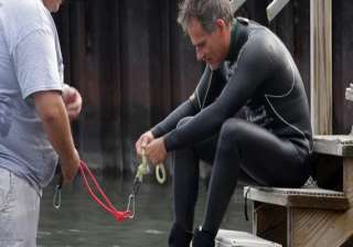 man swims to detroit hauling brick laden dinghies... man swims to detroit hauling brick laden dinghies...
