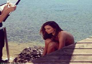 miranda kerr strips for a swimsuit shoot in... miranda kerr strips for a swimsuit shoot in...