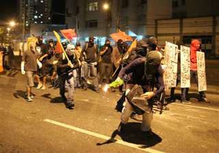 fifa world cup police fire tear gas at protesters... fifa world cup police fire tear gas at protesters...