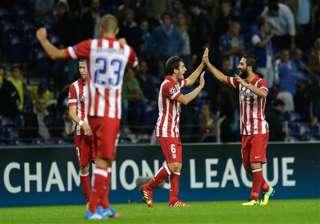 turan goal gives atletico madrid 2 1 win at porto... turan goal gives atletico madrid 2 1 win at porto...