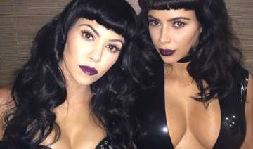 kim kourtney flaunt cleavage baring suits - India... kim kourtney flaunt cleavage baring suits - India...