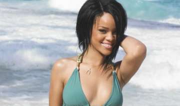 rihanna s charity for wolves see pics - India TV rihanna s charity for wolves see pics - India TV