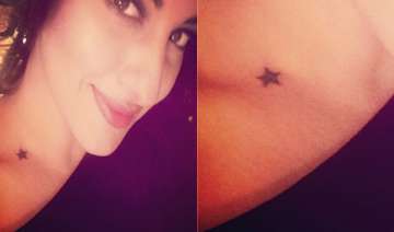 sonakshi sinha gets a star tattoo inked on her... sonakshi sinha gets a star tattoo inked on her...